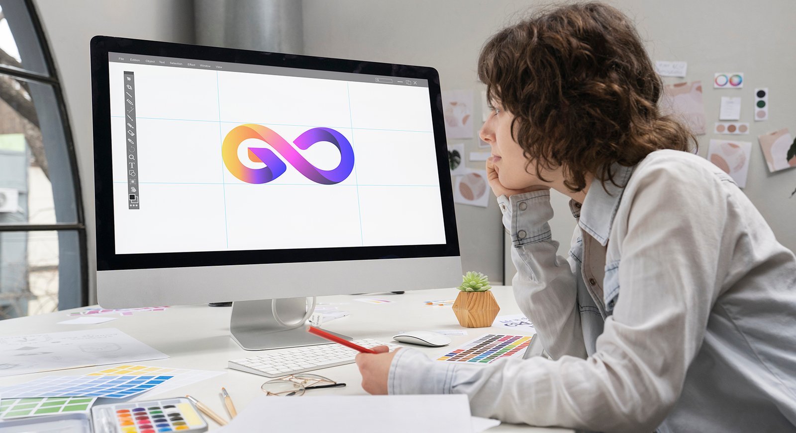logo-designer-working-computer-desktop
